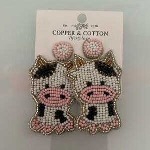 handmade beaded cow earrings.